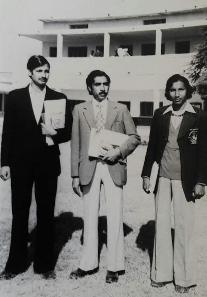 Student Union leaders standing in front of college block, 1976-77