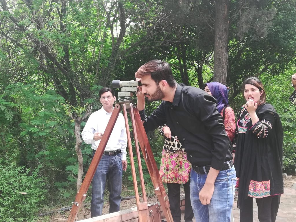 Geography students during a practical surveying session on campus